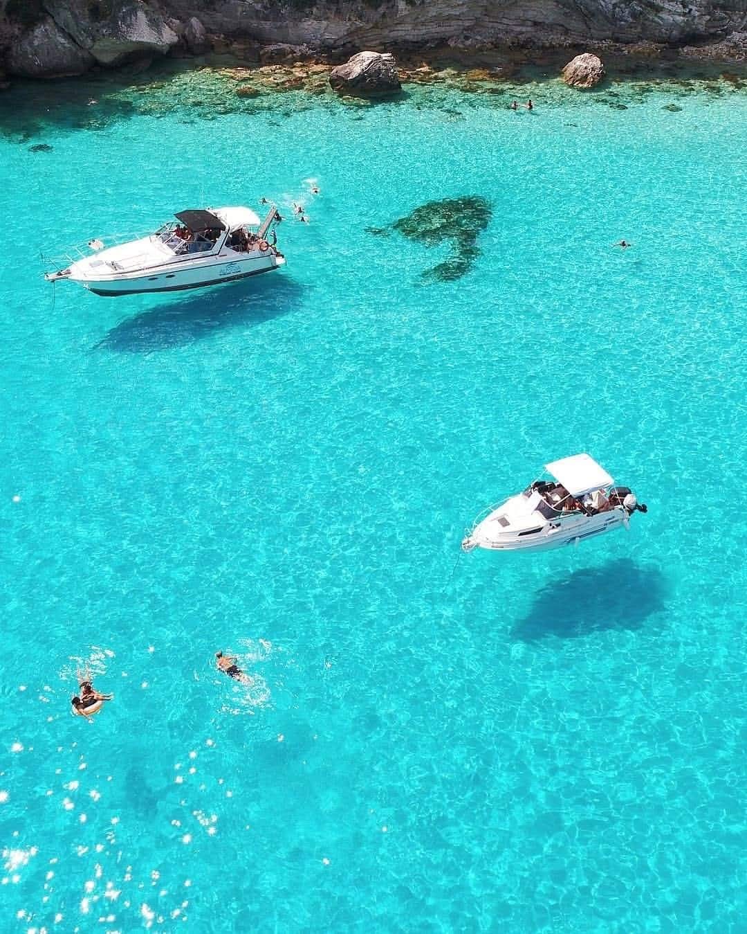 Turquoise water and swimmers near Antipaxos
